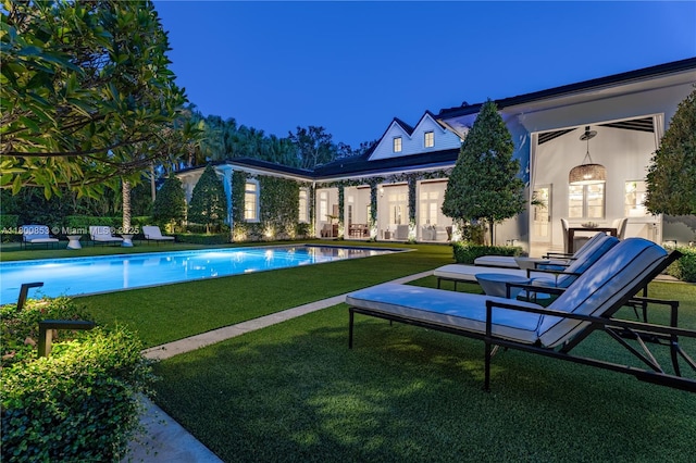 outdoor pool with a yard