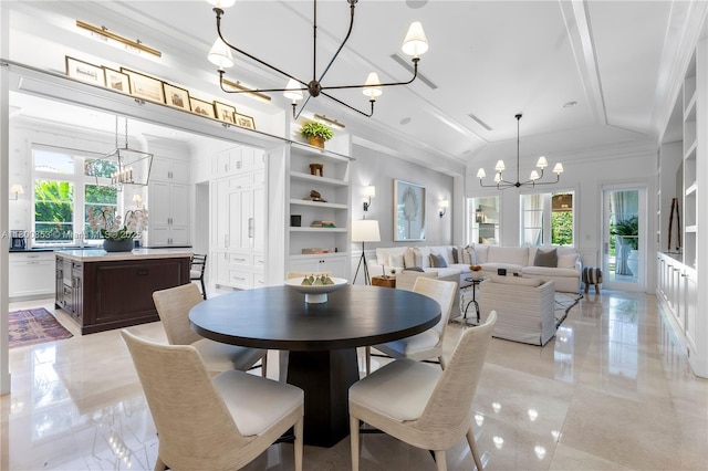dining room featuring a chandelier, healthy amount of natural light, vaulted ceiling, and crown molding