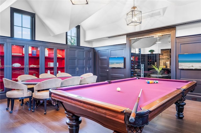 game room featuring vaulted ceiling, wood finished floors, and billiards
