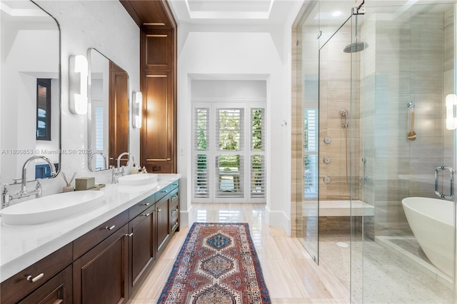 bathroom with a shower stall, double vanity, and tile patterned floors