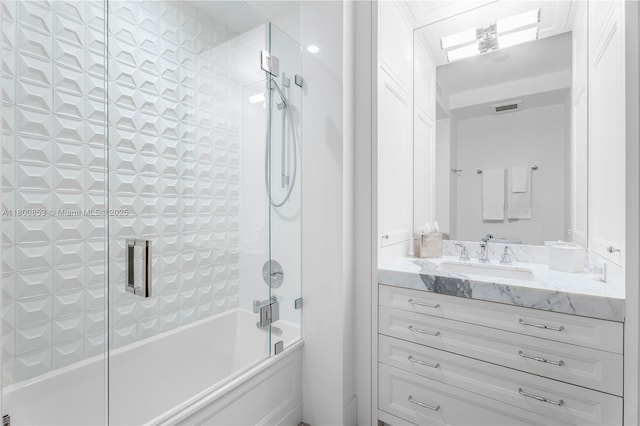 full bath featuring enclosed tub / shower combo and vanity