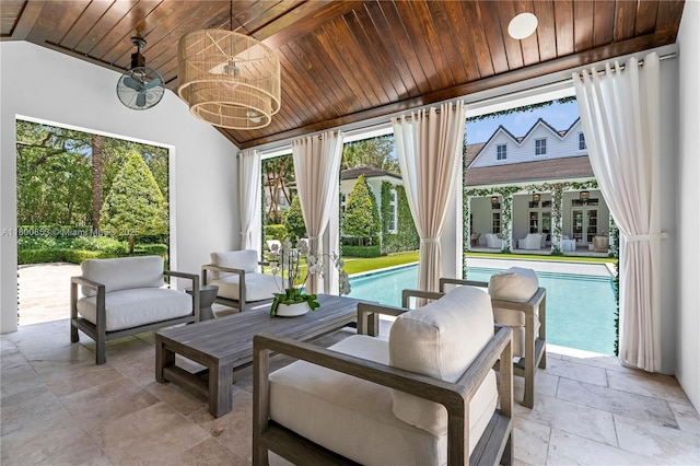 sunroom featuring vaulted ceiling