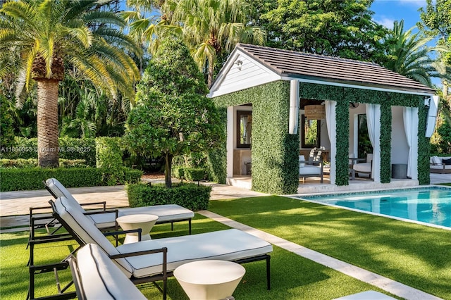 outdoor pool with a storage structure, a patio, an outdoor structure, and a lawn