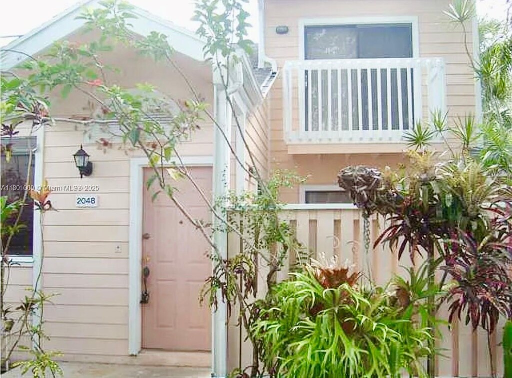 2058 Winners Cir, North Lauderdale, FL 33068 - view of exterior entry with a garage