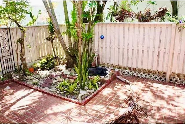 2058 Winners Cir, North Lauderdale, FL 33068 - fenced backyard featuring a patio area