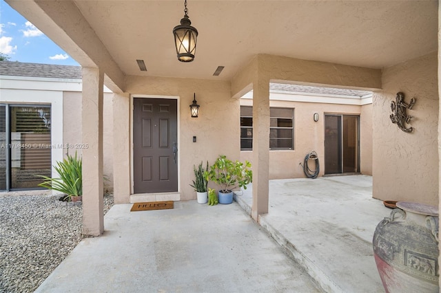 15251 SW 154th Ave, Miami, FL 33187 - entrance to property with stucco siding and a patio