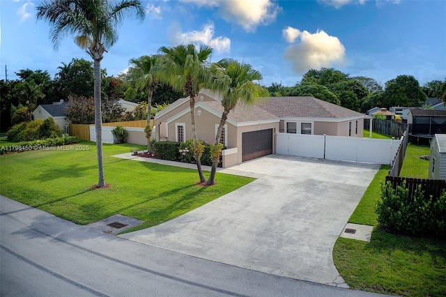 15251 SW 154th Ave, Miami, FL 33187 - view of front facade featuring a garage, concrete driveway, and stucco siding