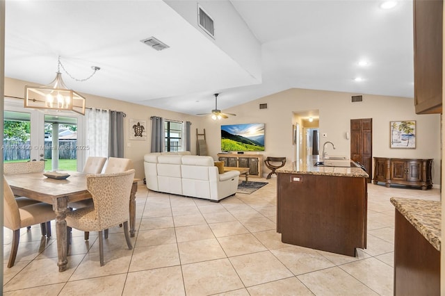 15251 SW 154th Ave, Miami, FL 33187 - dining area featuring lofted ceiling, plenty of natural light, light tile patterned floors, ceiling fan, and a chandelier