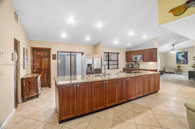 15251 SW 154th Ave, Miami, FL 33187 - kitchen with stainless steel appliances, a sink, light tile patterned floors, ceiling fan, and a large island with sink