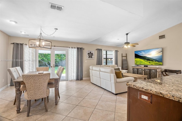 15251 SW 154th Ave, Miami, FL 33187 - dining area featuring healthy amount of natural light, baseboards, a chandelier, vaulted ceiling, and light tile patterned floors