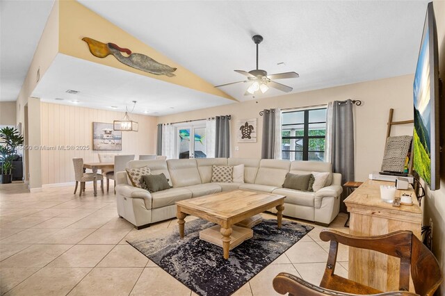 15251 SW 154th Ave, Miami, FL 33187 - living area with light tile patterned floors, ceiling fan, vaulted ceiling, and baseboards