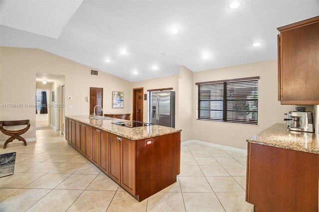 15251 SW 154th Ave, Miami, FL 33187 - kitchen featuring stainless steel fridge, light tile patterned floors, baseboards, vaulted ceiling, and light stone counters