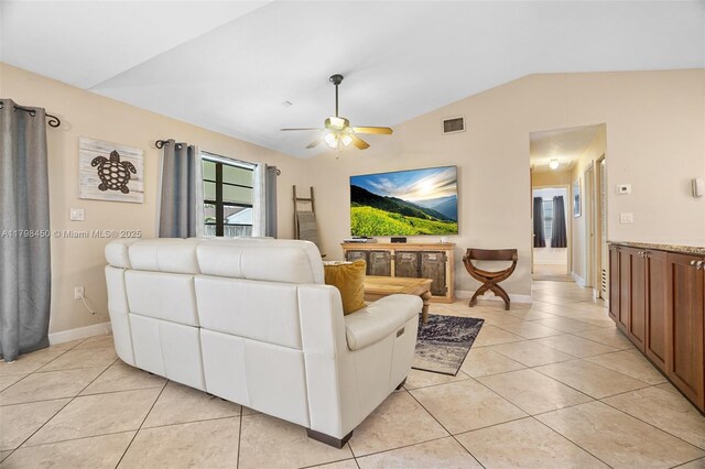 15251 SW 154th Ave, Miami, FL 33187 - living room with lofted ceiling, light tile patterned floors, ceiling fan, and baseboards