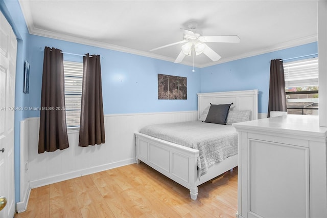 15251 SW 154th Ave, Miami, FL 33187 - bedroom with light wood finished floors, crown molding, ceiling fan, a wainscoted wall, and baseboards