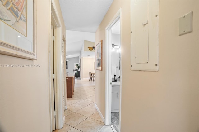 15251 SW 154th Ave, Miami, FL 33187 - corridor featuring electric panel, light tile patterned floors, and baseboards