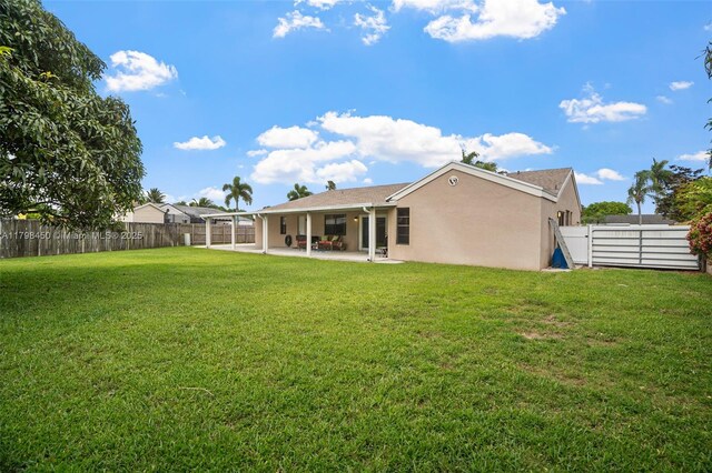 15251 SW 154th Ave, Miami, FL 33187 - rear view of property with a patio area and stucco siding