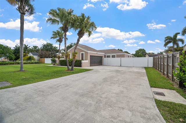 15251 SW 154th Ave, Miami, FL 33187 - ranch-style house with driveway, a garage, and stucco siding
