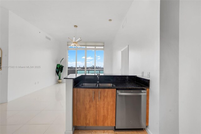 7910 Harbor Island Dr Unit 1208, North Bay Village, FL 33141 - kitchen featuring stainless steel dishwasher, a sink, brown cabinets, dark stone counters, and a chandelier