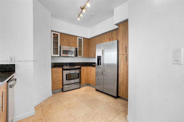 7910 Harbor Island Dr Unit 1208, North Bay Village, FL 33141 - kitchen with appliances with stainless steel finishes, brown cabinetry, glass insert cabinets, and baseboards
