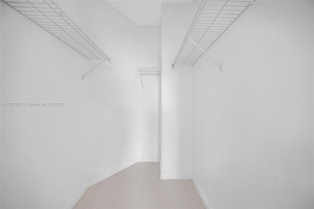 7910 Harbor Island Dr Unit 1208, North Bay Village, FL 33141 - walk in closet with tile patterned flooring