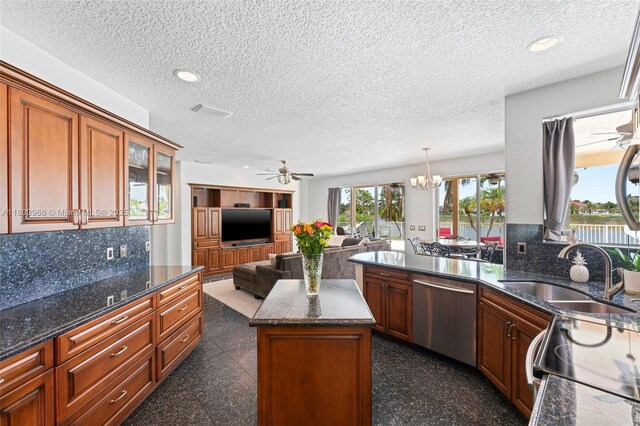 1106 NW 180th Ave, Pembroke Pines, FL 33029 - kitchen with dishwasher, a sink, tasteful backsplash, a textured ceiling, and a ceiling fan