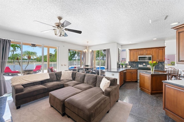 1106 NW 180th Ave, Pembroke Pines, FL 33029 - living room featuring a ceiling fan, a textured ceiling, recessed lighting, and granite tiled floors