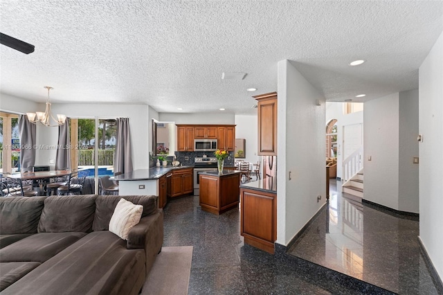1106 NW 180th Ave, Pembroke Pines, FL 33029 - living room featuring a chandelier, granite tiled floors, baseboards, recessed lighting, and stairs