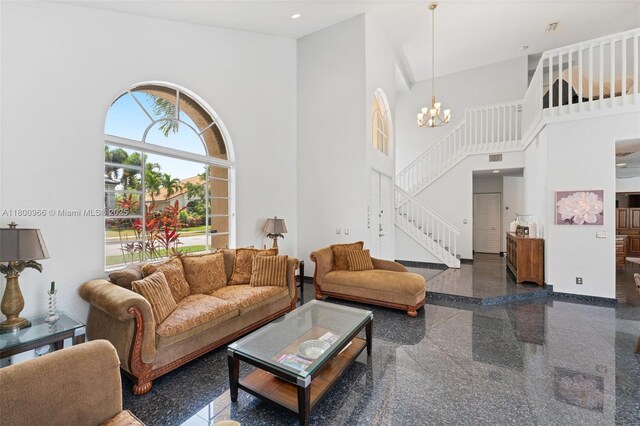 1106 NW 180th Ave, Pembroke Pines, FL 33029 - living area featuring granite tiled floors, stairway, a towering ceiling, a chandelier, and baseboards