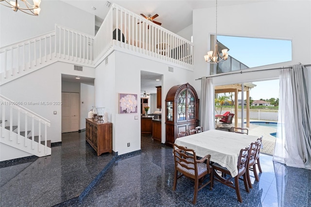 1106 NW 180th Ave, Pembroke Pines, FL 33029 - dining area with a chandelier, a towering ceiling, stairway, and granite floors