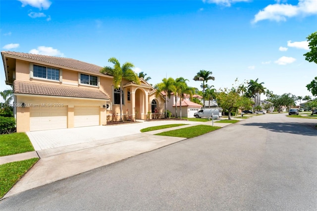 1106 NW 180th Ave, Pembroke Pines, FL 33029 - view of front facade with concrete driveway, stucco siding, a tiled roof, and a garage