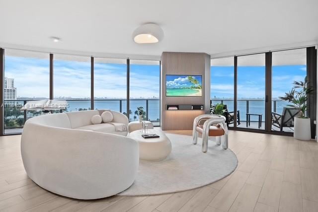488 NE 18th St Unit 715, Miami, FL 33132 - living room featuring a wall of windows and light wood-type flooring