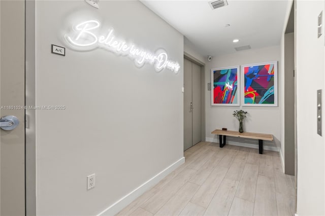 488 NE 18th St Unit 715, Miami, FL 33132 - hallway with light wood-style flooring and baseboards