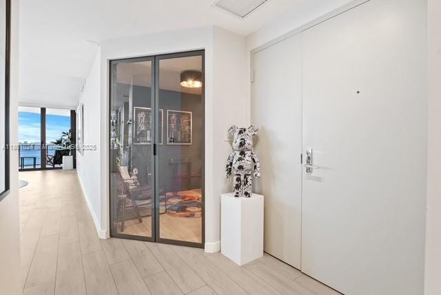 488 NE 18th St Unit 715, Miami, FL 33132 - hallway featuring light wood-style floors