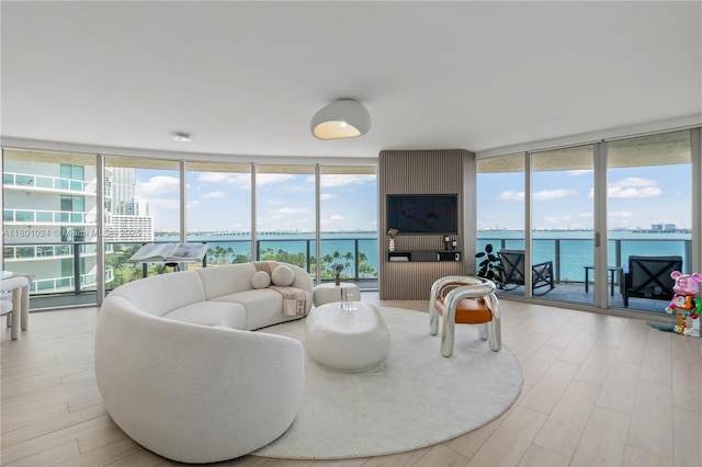488 NE 18th St Unit 715, Miami, FL 33132 - living room featuring a wall of windows, plenty of natural light, and wood finished floors