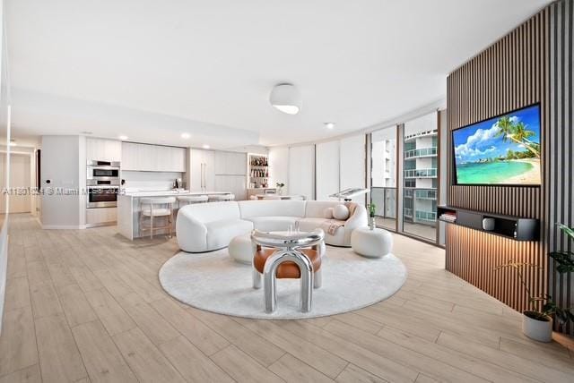 488 NE 18th St Unit 715, Miami, FL 33132 - living area with light wood-style flooring and recessed lighting