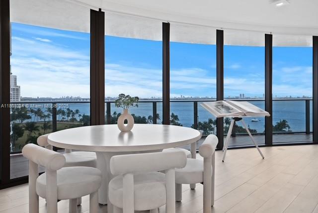 488 NE 18th St Unit 715, Miami, FL 33132 - dining space with plenty of natural light, a water view, and expansive windows