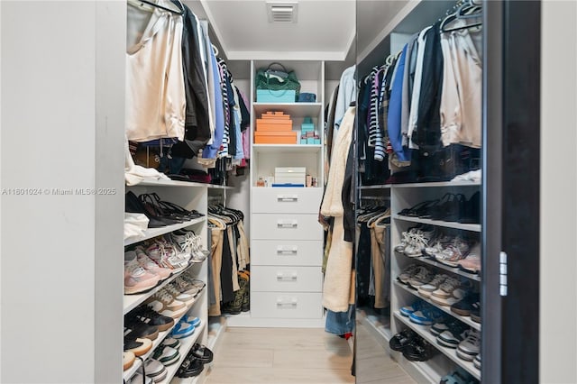 488 NE 18th St Unit 715, Miami, FL 33132 - walk in closet featuring wood finished floors