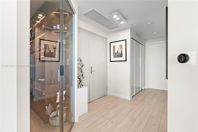 488 NE 18th St Unit 715, Miami, FL 33132 - hallway with wood finished floors and baseboards