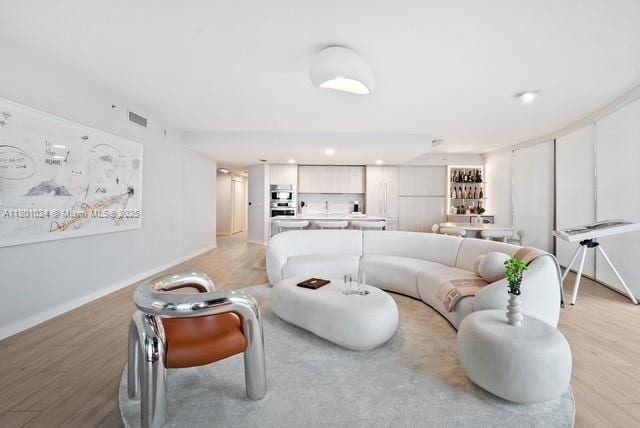 488 NE 18th St Unit 715, Miami, FL 33132 - living room featuring light wood-type flooring and baseboards