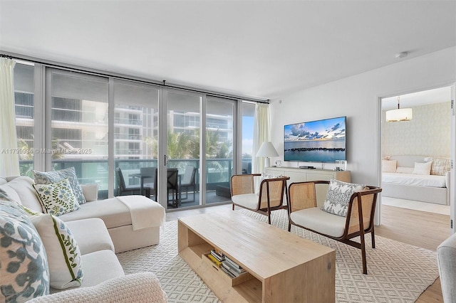 9401 Collins Ave Unit 505, Surfside, FL 33154 - living room with light wood-style flooring and expansive windows