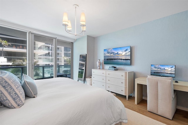 9401 Collins Ave Unit 505, Surfside, FL 33154 - bedroom featuring wood finished floors and a chandelier