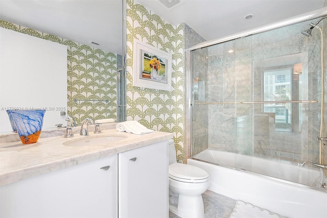 9401 Collins Ave Unit 505, Surfside, FL 33154 - bathroom featuring wallpapered walls, toilet, enclosed tub / shower combo, and vanity