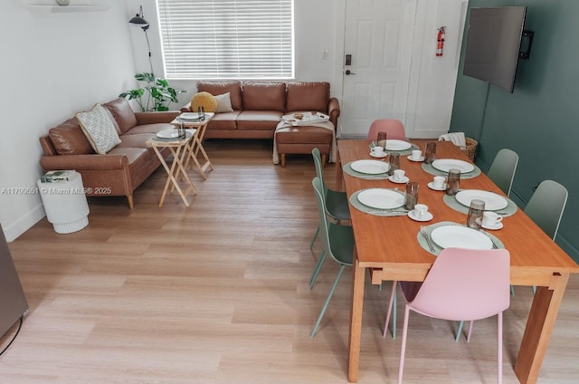 1153 NE 158th St, North Miami Beach, FL 33162 - dining room featuring light wood-type flooring
