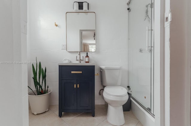 1153 NE 158th St, North Miami Beach, FL 33162 - bathroom featuring a shower stall, tile patterned floors, vanity, and toilet