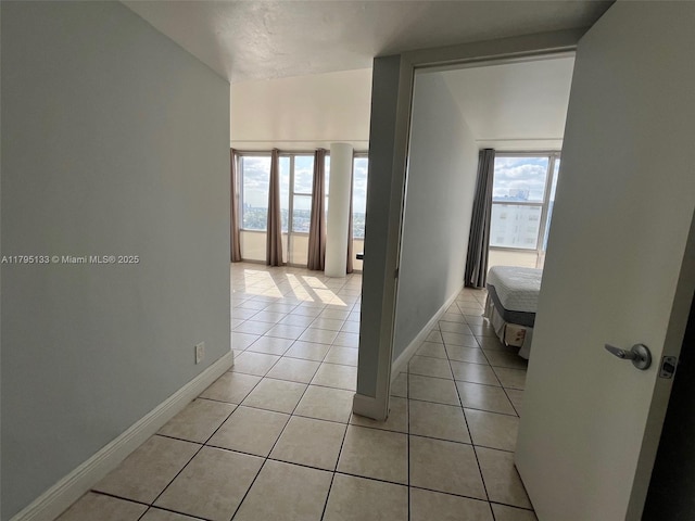900 Bay Dr Unit 913, Miami Beach, FL 33141 - hall with light tile patterned flooring and baseboards