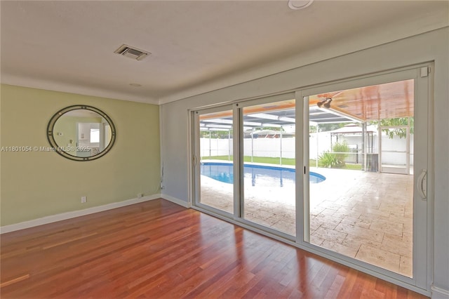 5261 NE 18th Ter, Fort Lauderdale, FL 33308 - spare room with baseboards and wood finished floors