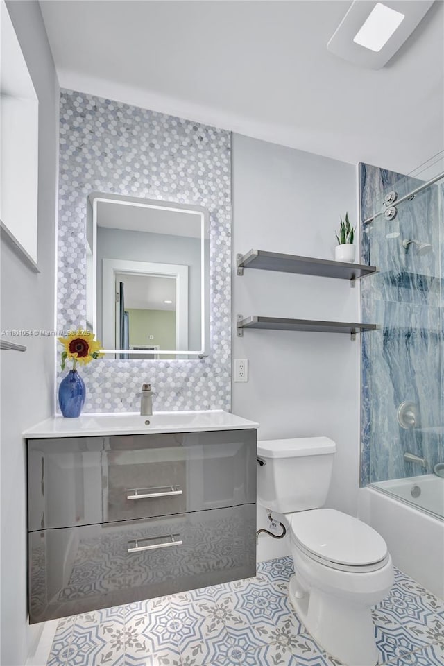 5261 NE 18th Ter, Fort Lauderdale, FL 33308 - full bathroom with toilet, vanity, tile patterned floors, and shower / tub combination