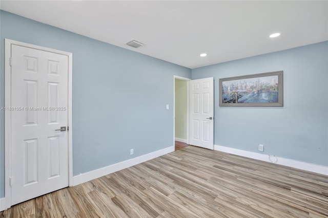 5261 NE 18th Ter, Fort Lauderdale, FL 33308 - spare room with light wood-style floors, baseboards, and recessed lighting
