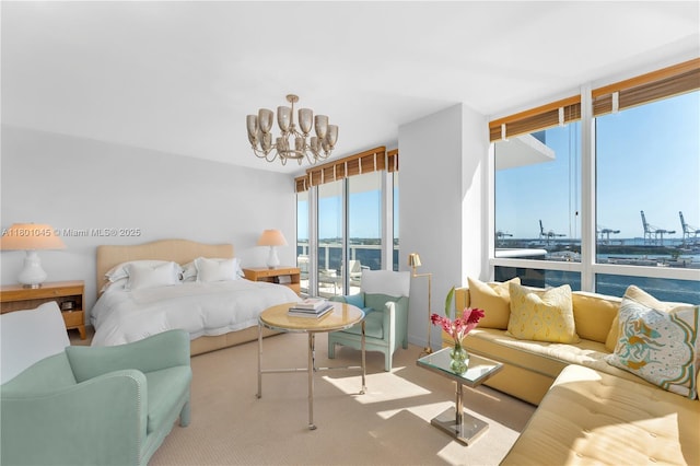 400 Alton Rd Unit 1101, Miami Beach, FL 33139 - bedroom featuring a chandelier, carpet, a water view, and floor to ceiling windows