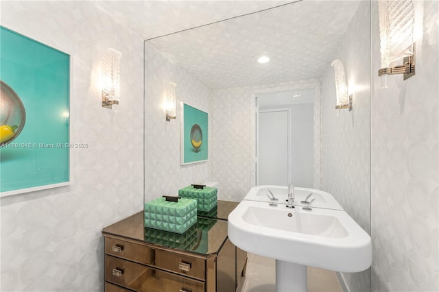 400 Alton Rd Unit 1101, Miami Beach, FL 33139 - bathroom featuring wallpapered walls and a sink